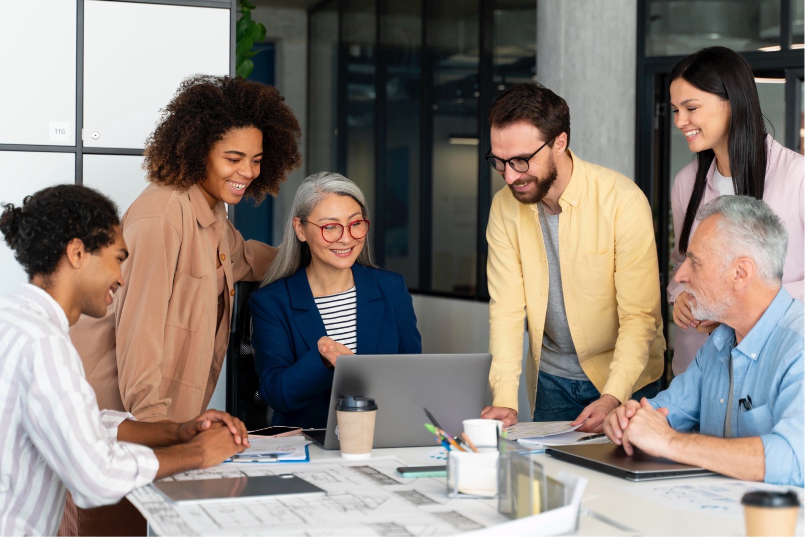 Group of employees discussing workplace benefits and corporate health insurance.