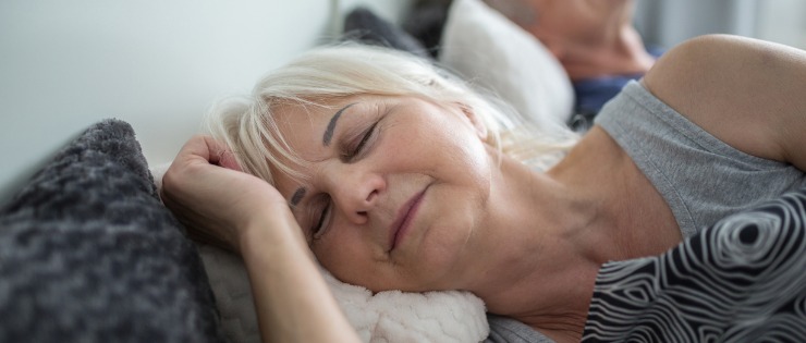  Middle aged woman getting a good night's sleep 