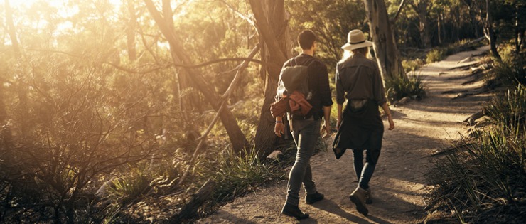 Couple walking in Sydney’s bushland on the weekend 