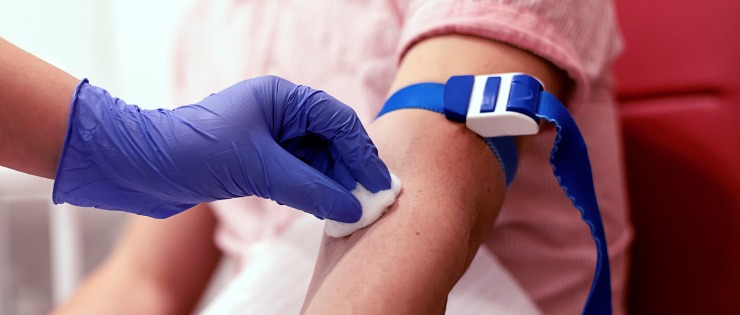 A young female getting a blood test to donate blood stem cells. 