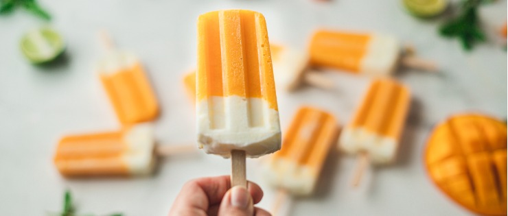 Mango and yoghurt popsicles as a healthy ice cream alternative.