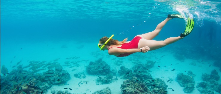 Young female snorkelling under water on Rottnest Island