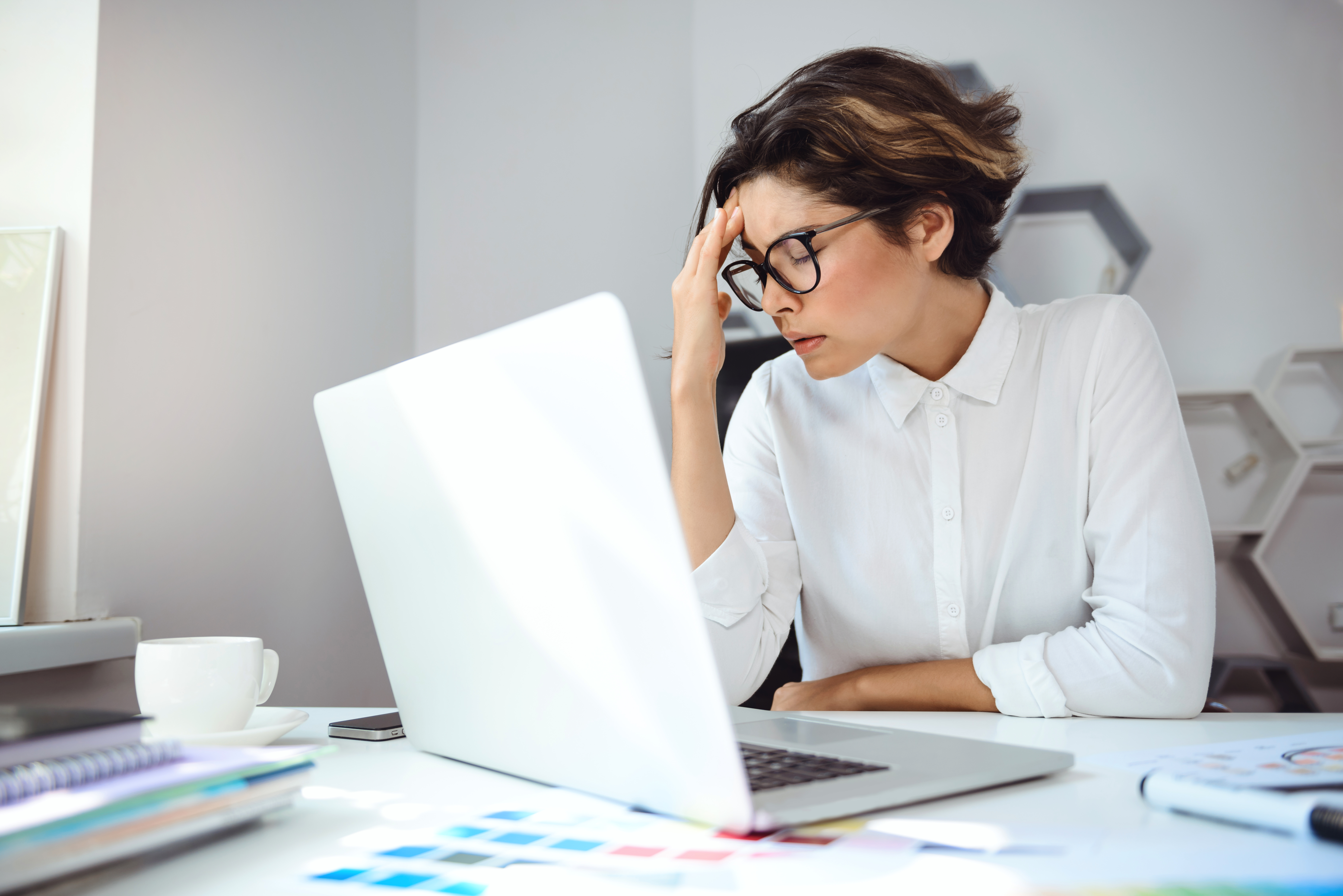 Stressed woman in work place