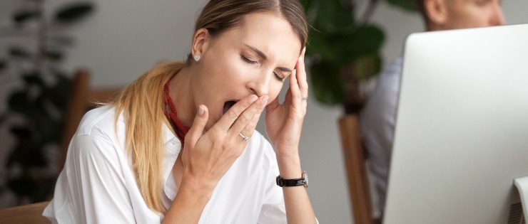 A fatigued woman suffering from an increase of cortisol in the body